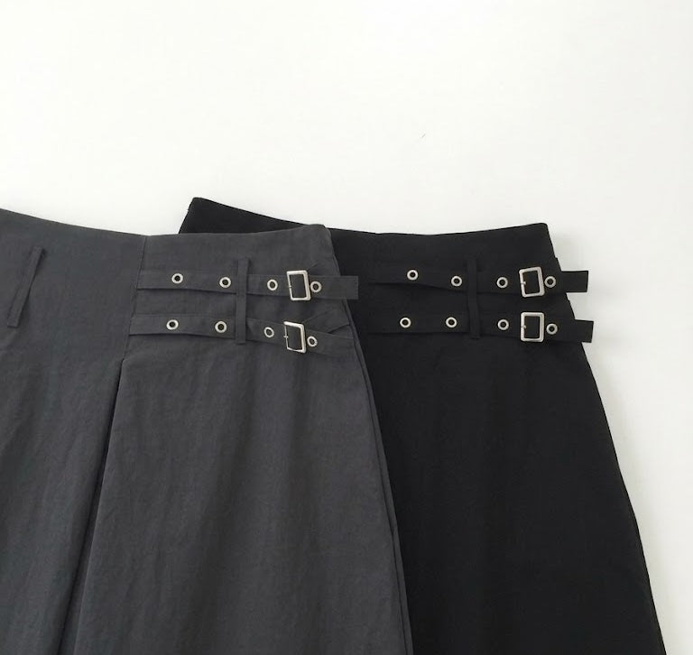 Newol Double Buckle Eyelet Pleated Midi Skirt — Asymmetric Hem