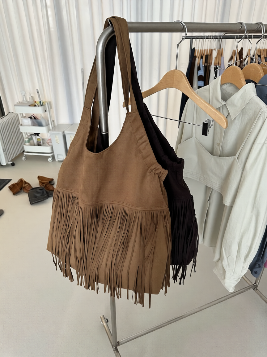 Suede Fringe Shoulder Bag Camel and Dark Brown on rack front