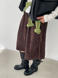 Wide-Leg Tassel Shorts Brown front view styled with boots