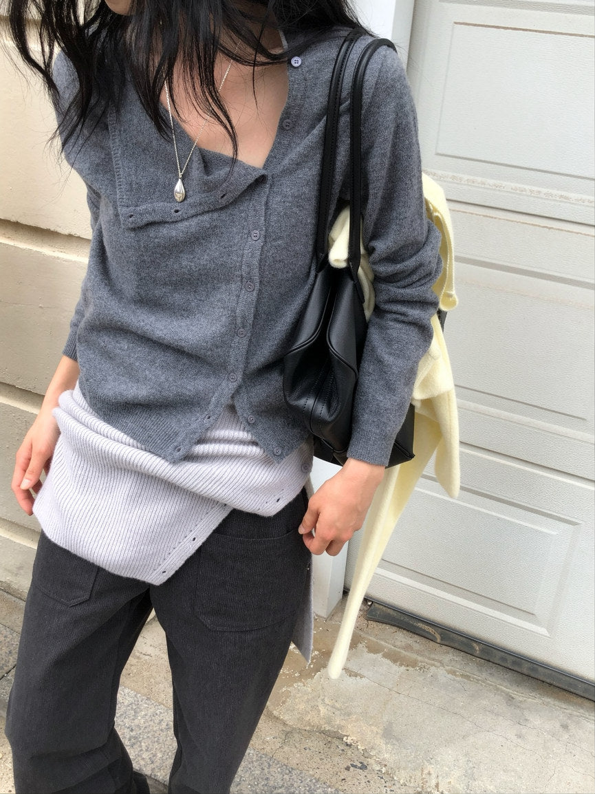 Red asymmetric button knit cardigan styled with black pants