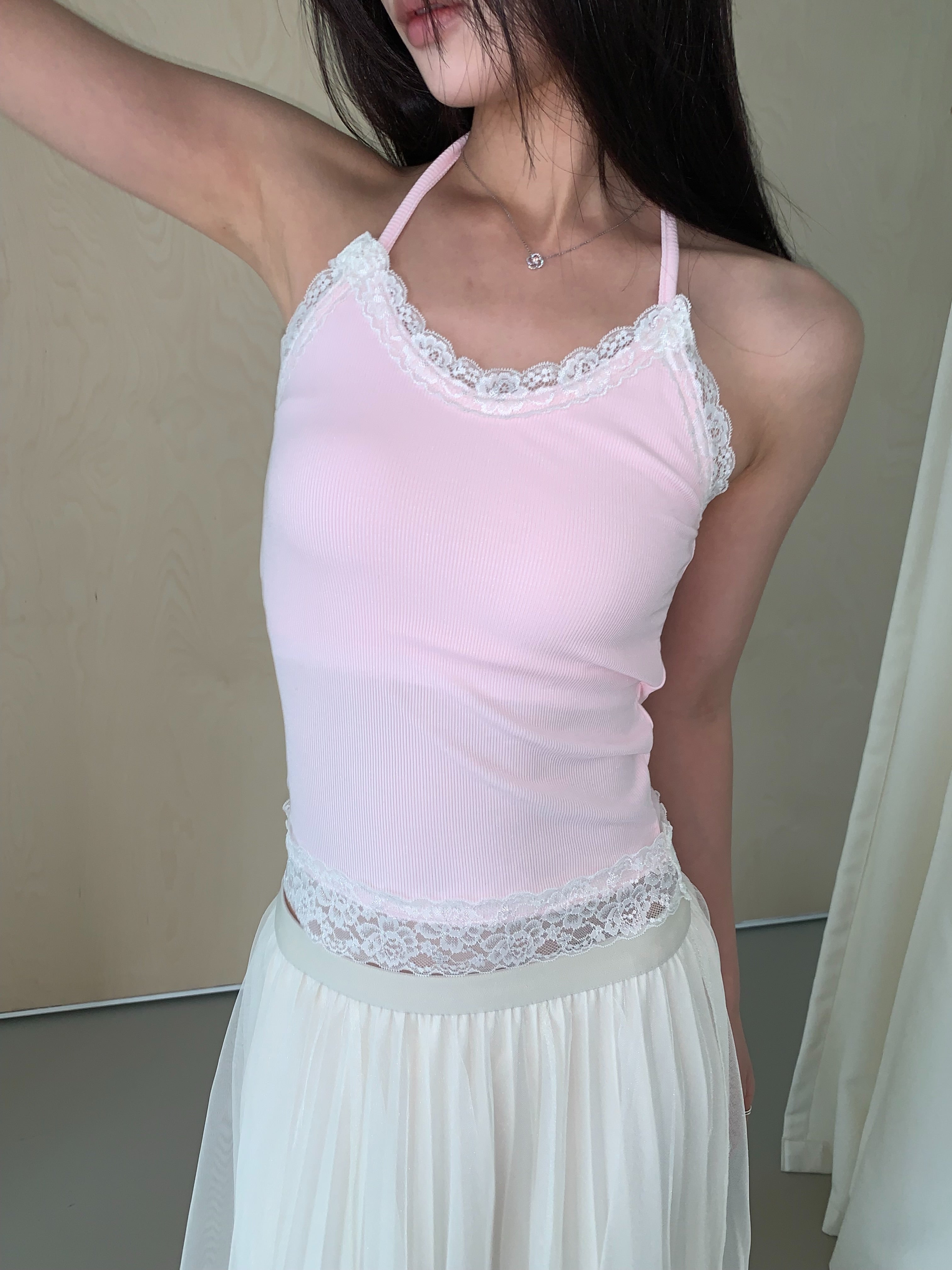 Poésie lace trim halter tank top in Pink, front view standing with white skirt