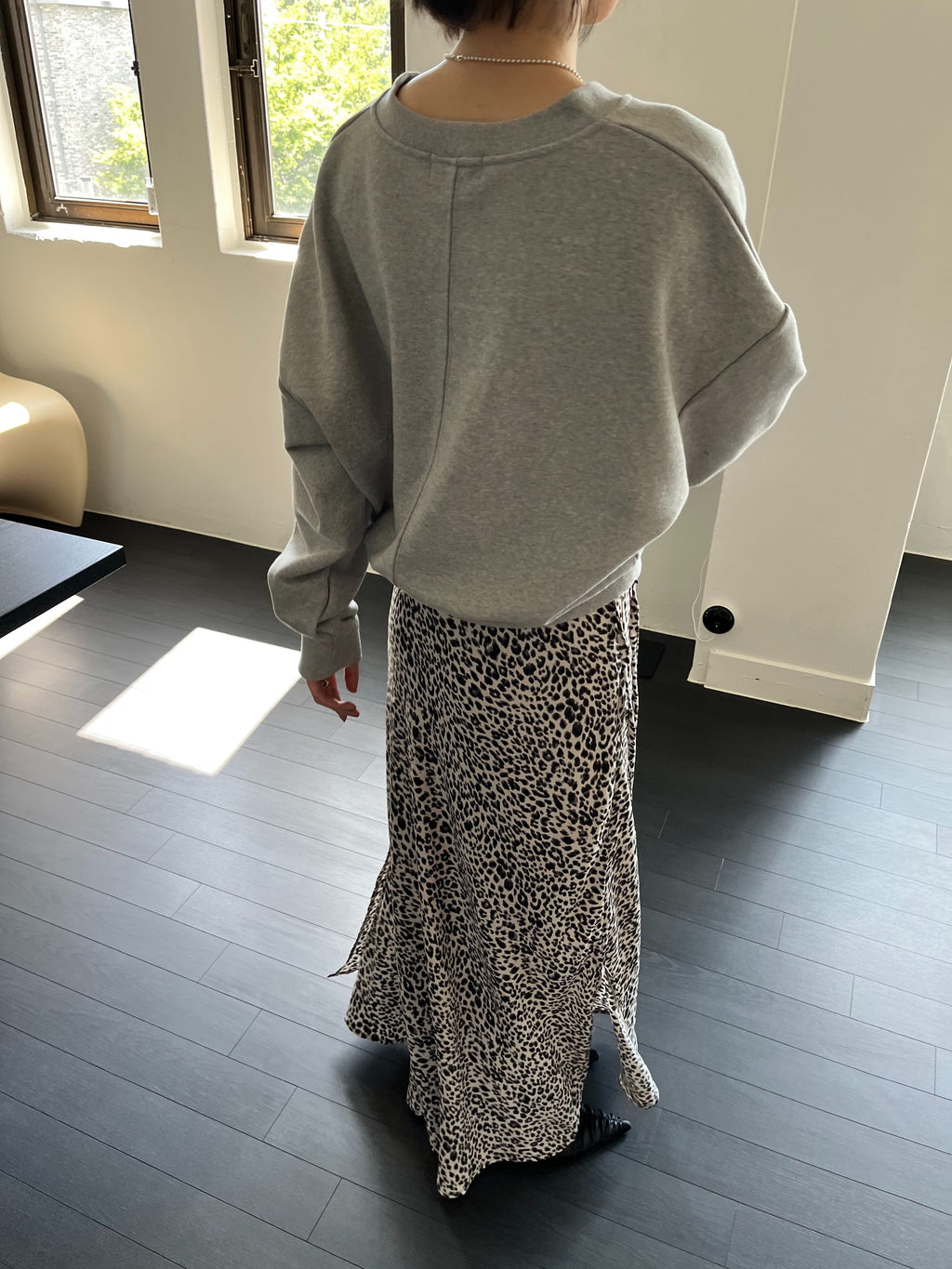 Leopard Print Maxi Skirt Ivory front view styled with grey v-neck sweatshirt