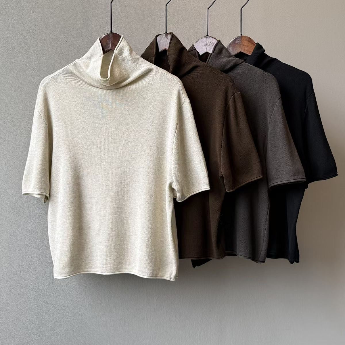 Front view of a brown knit top showing its mock neckline and short sleeves.