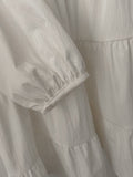 Vestito a balze con maniche a sbuffo