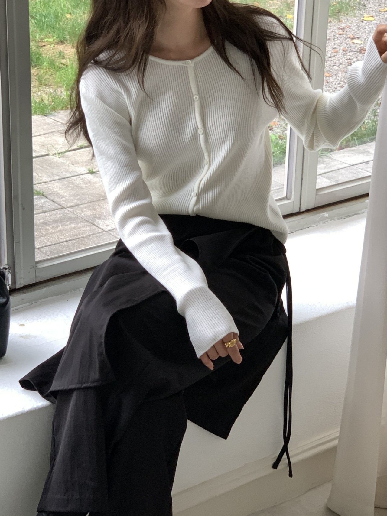 Top in maglia a costine con bottoni
