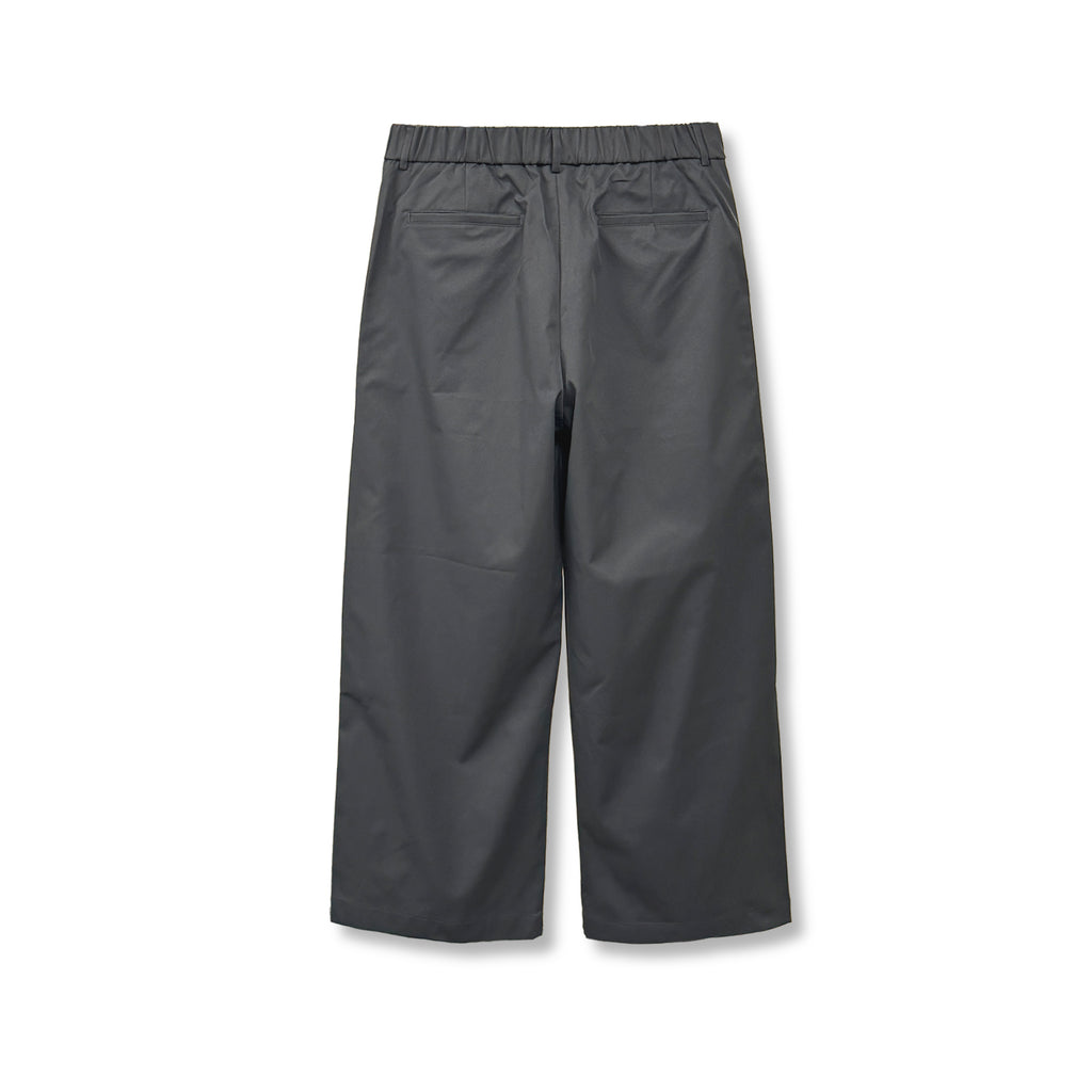 Gumi cross tuck wide leg pants in Brown, back elastic waistband and welt pocket close-up