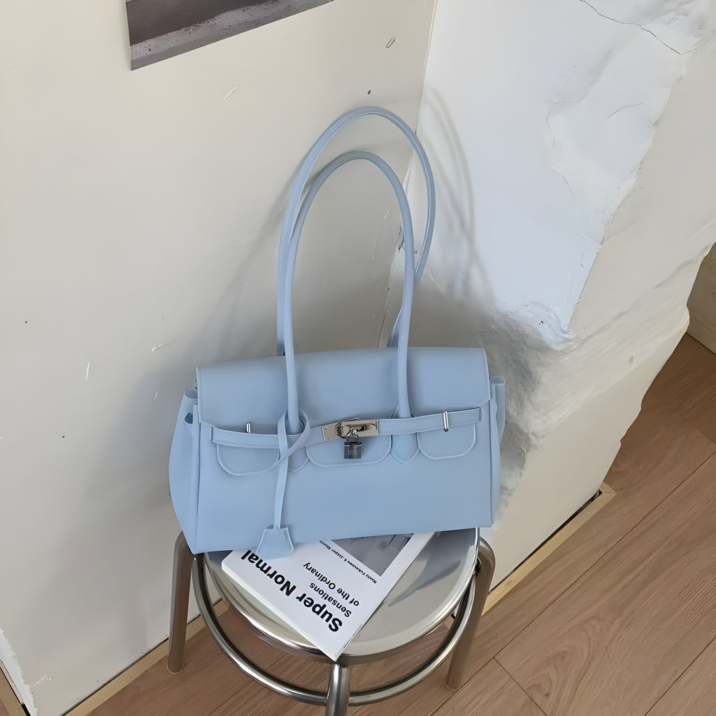 Seoro birkin style square baguette jelly bag in Orange, front view on ottoman
