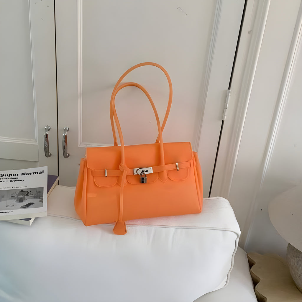 Seoro birkin style square baguette jelly bag in Aqua Blue, front view on ottoman