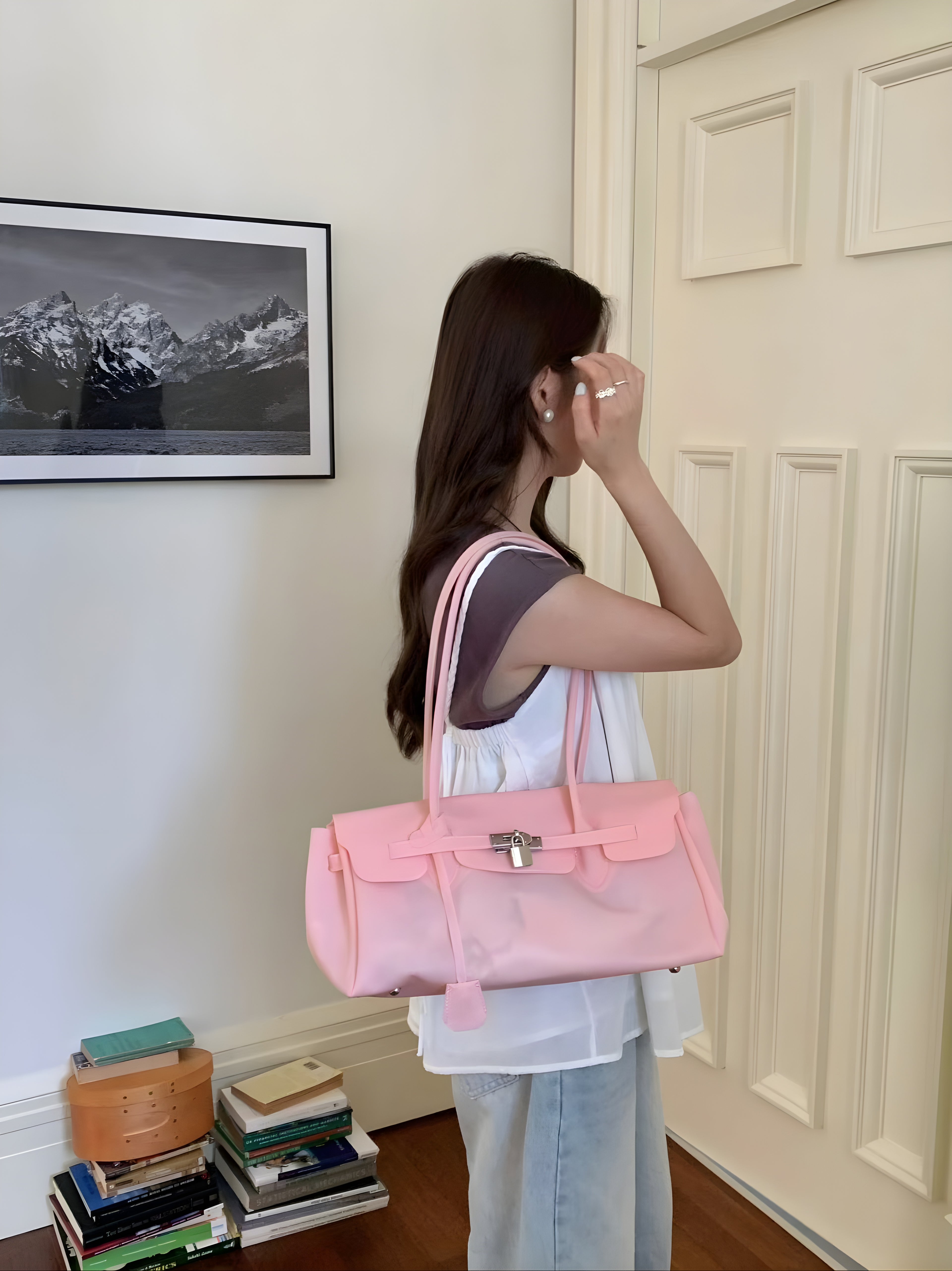 Seoro birkin style baguette jelly bag in White, styled on model side view held by double handles