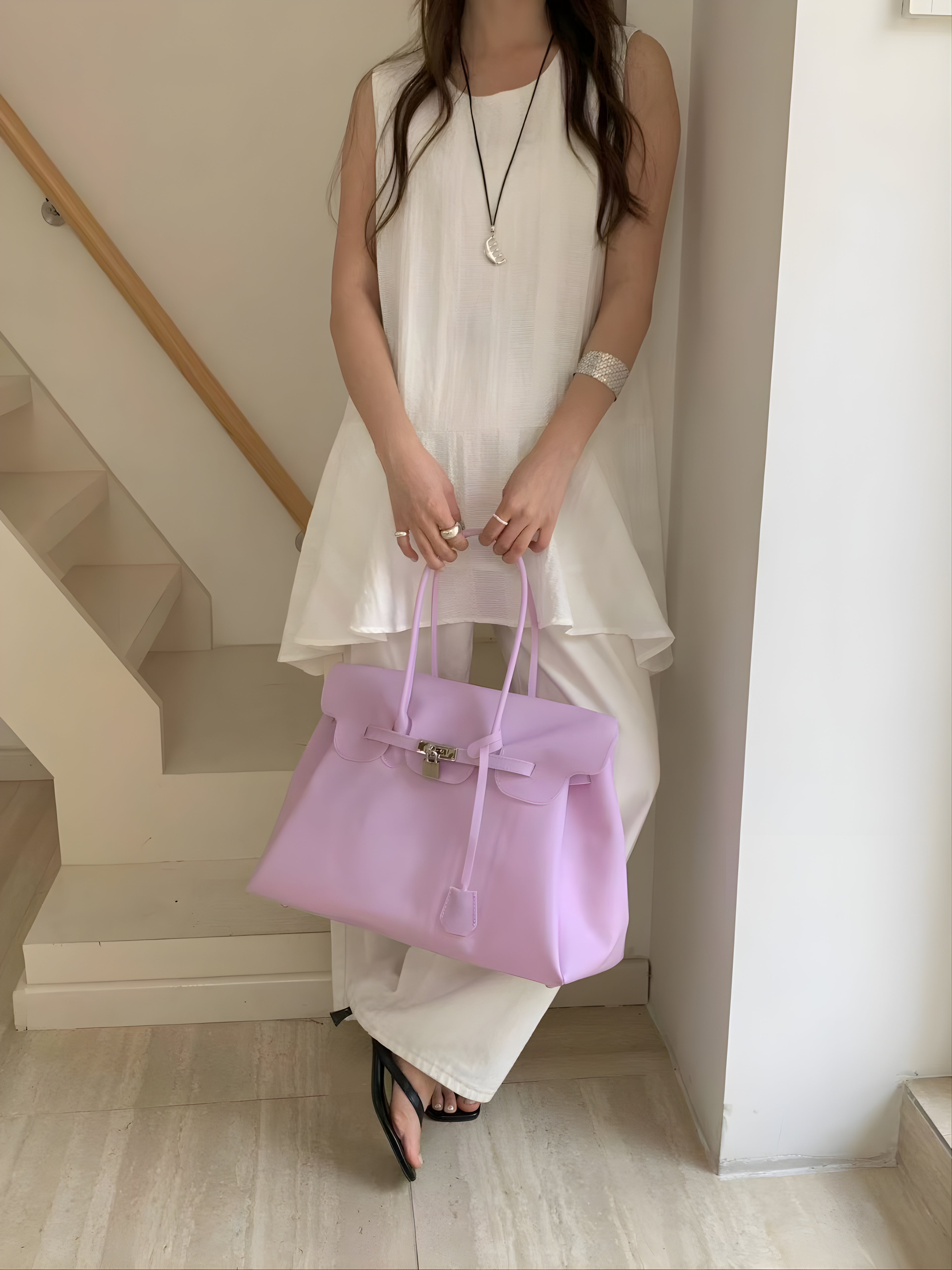 Birkin style large jelly tote bag in White, styled on model seated front view