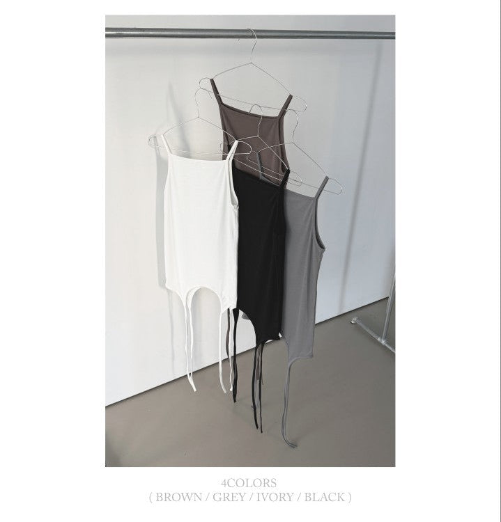 Askhaki square neck tank top with side tie strings in Brown, styled on model front view with black maxi skirt and necklace