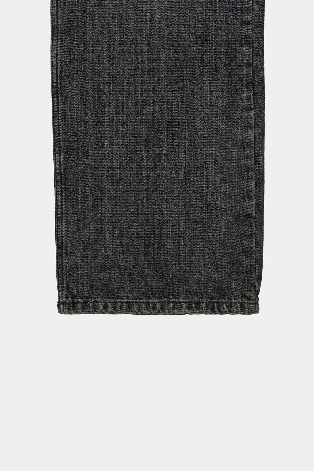Waistband, nickel button, rivets and YKK zipper detail on dark indigo jeans