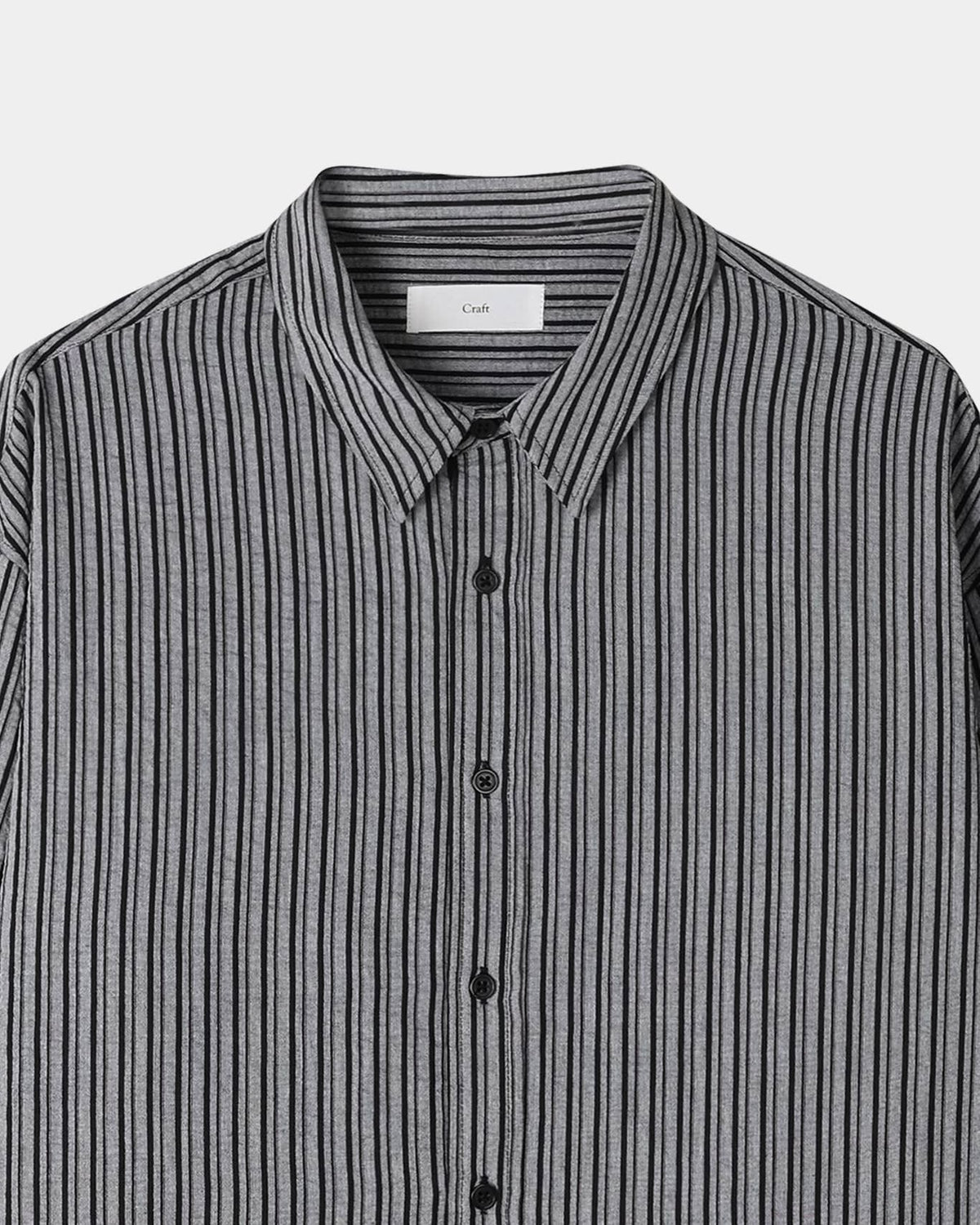 Black men's pinstripe shirt sleeve and buttoned cuff detail