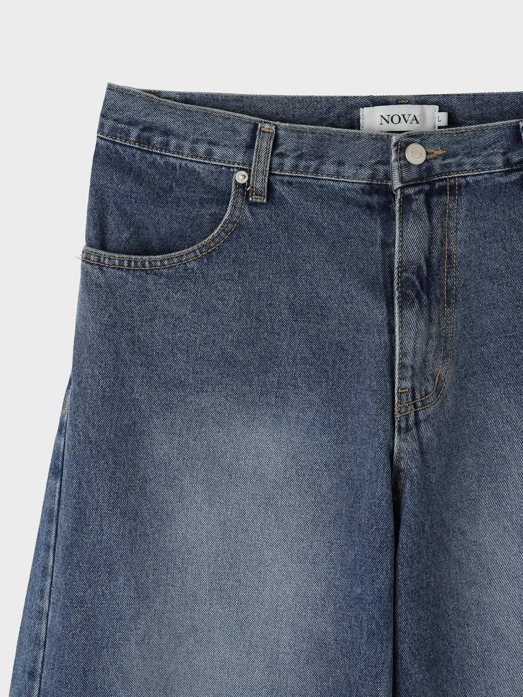 Jean sculpté à jambe large avec couture incurvée