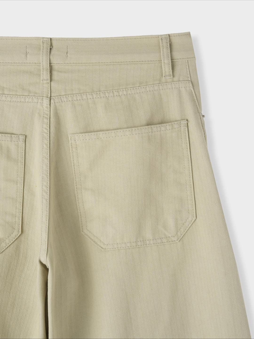 Pantaloni ampi in denim curvi a spina di pesce