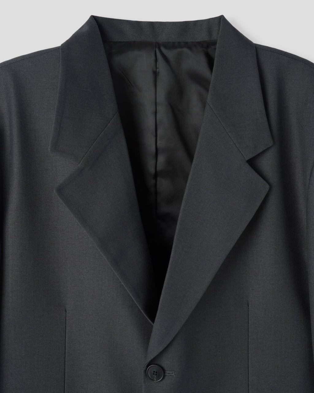 Corkage oversized single button blazer in Charcoal, back center vent close-up detail