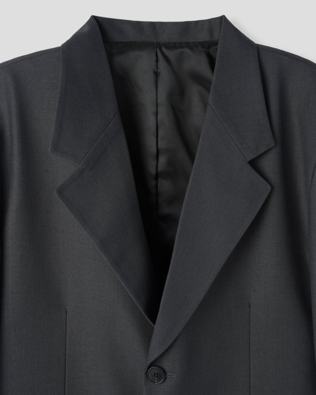 Corkage oversized single button blazer in Charcoal, back center vent close-up detail