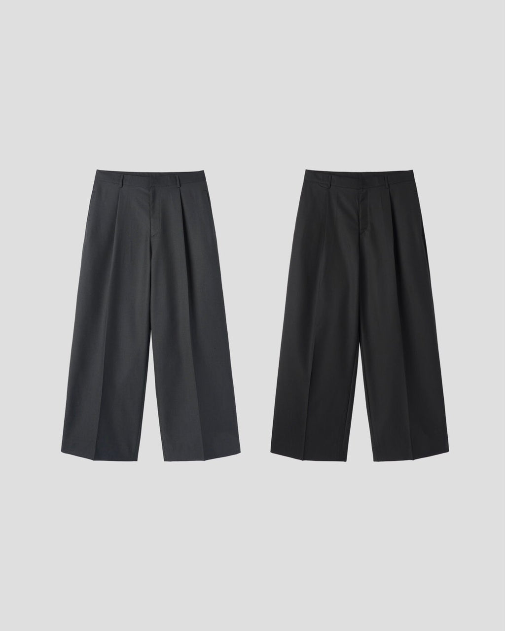 Corkage oversized one-tuck wide leg slacks in Charcoal, styled on model back view with white top