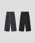 Corkage oversized one-tuck wide leg slacks in Charcoal, styled on model back view with white top