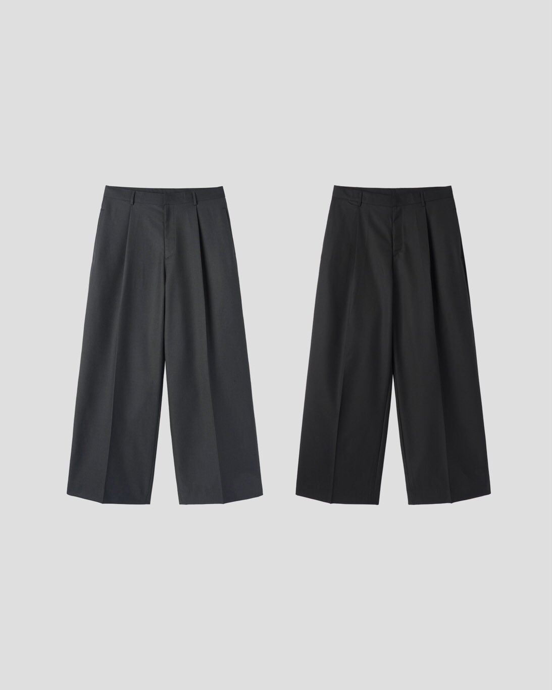 Corkage oversized one-tuck wide leg slacks in Charcoal, styled on model back view with white top