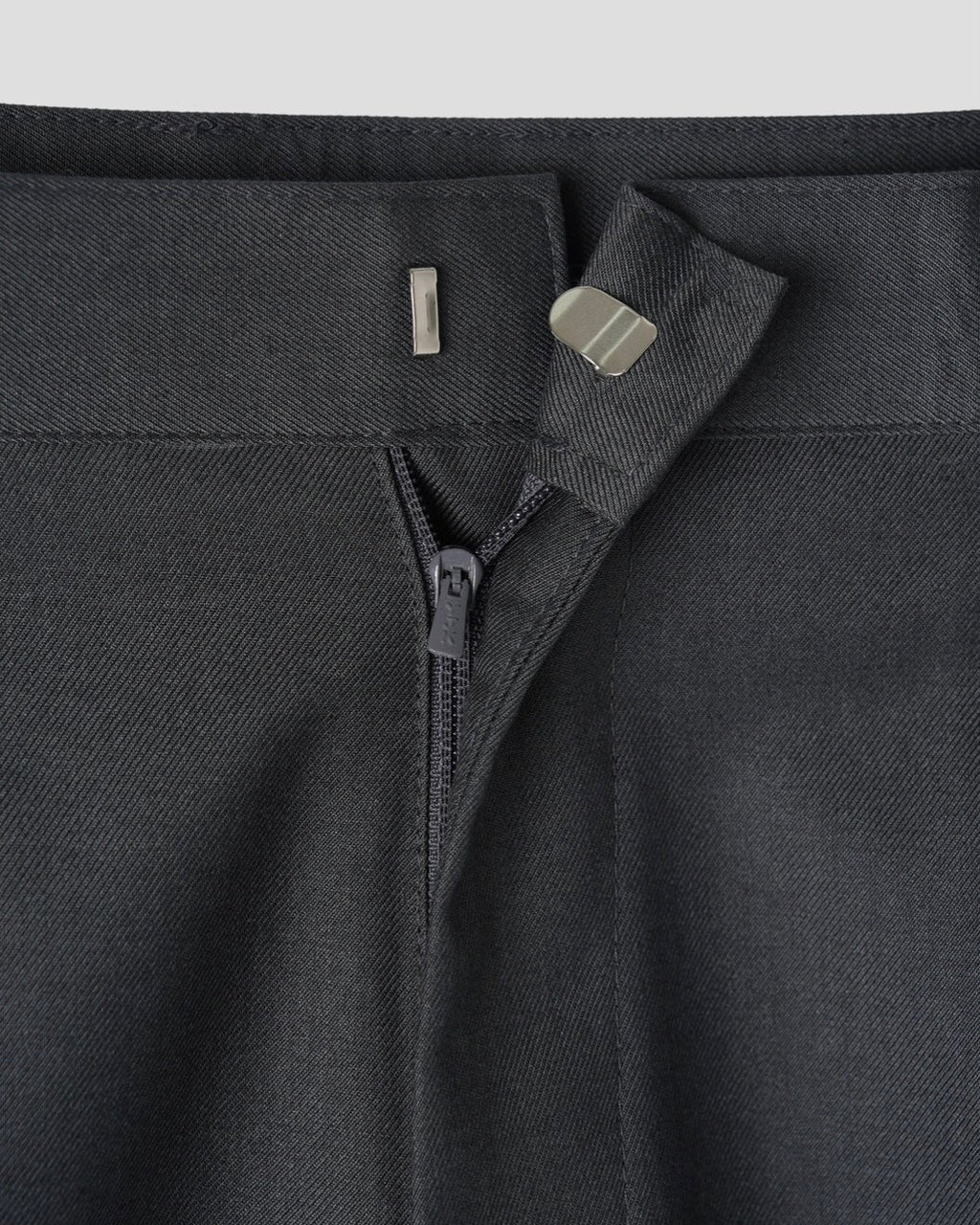 Corkage oversized one-tuck wide leg slacks in Black, zip and hook closure close-up detail