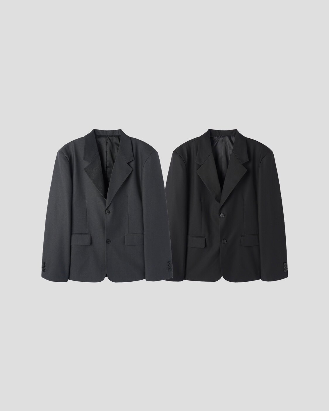 Corkage oversized single button blazer in Black, product flat lay side view on grey background