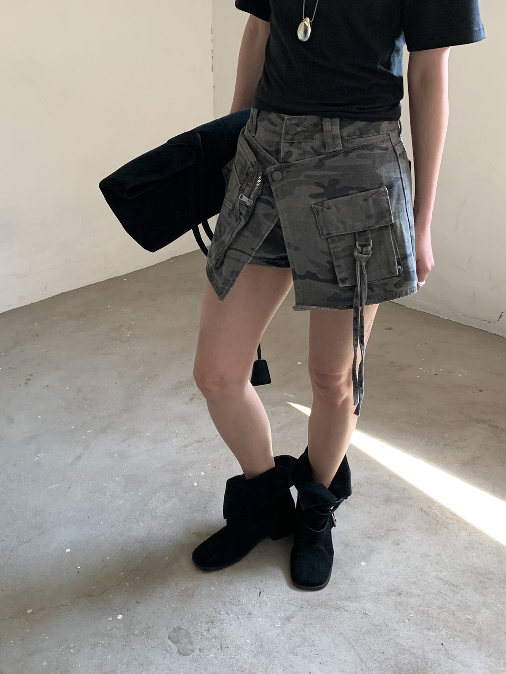 Vive L camo denim skort in Khaki, side view showing asymmetric hem