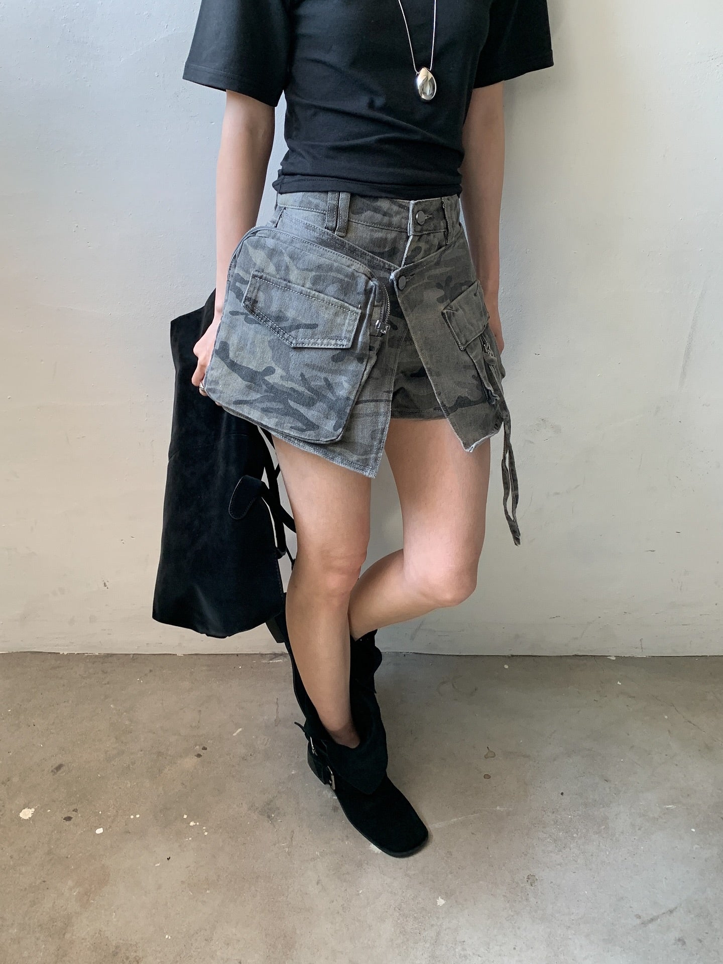 Vive L camo denim skort in Khaki, front view with strap detail