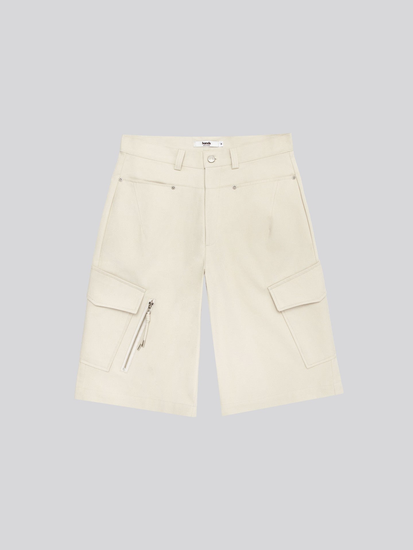 Twill Diagonal Zip Cargo Bermuda Shorts — Ivory cargo pocket close-up