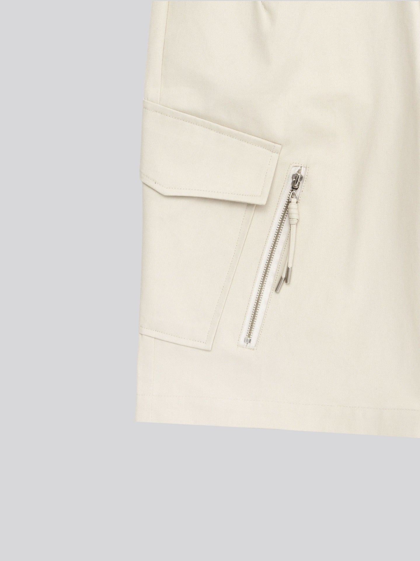 Twill Diagonal Zip Cargo Bermuda Shorts — hem detail