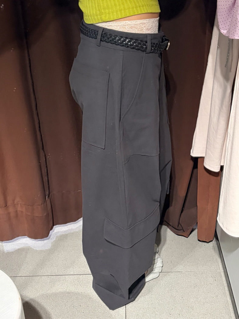 Vivel multi cargo pocket wide leg pants in Charcoal, styled on model front view close-up cargo pocket detail with yellow crop top