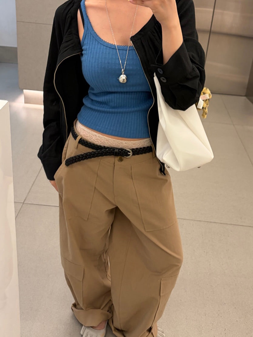 Vivel multi cargo pocket wide leg pants in Charcoal, styled on model side view with yellow crop top and braided belt