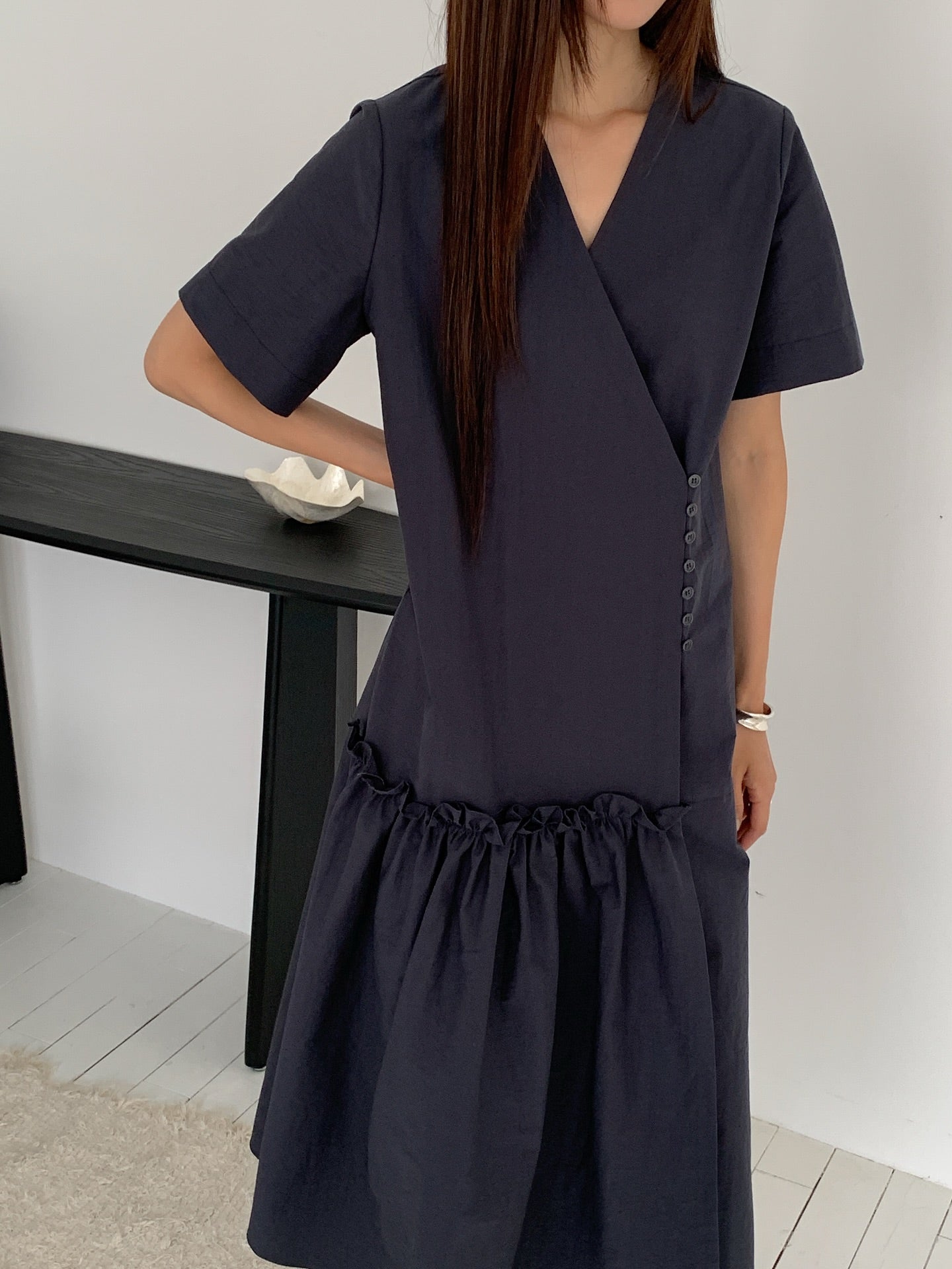 Vivel wrap shirring maxi dress in Charcoal, styled on model front view close-up drop waist shirring band detail
