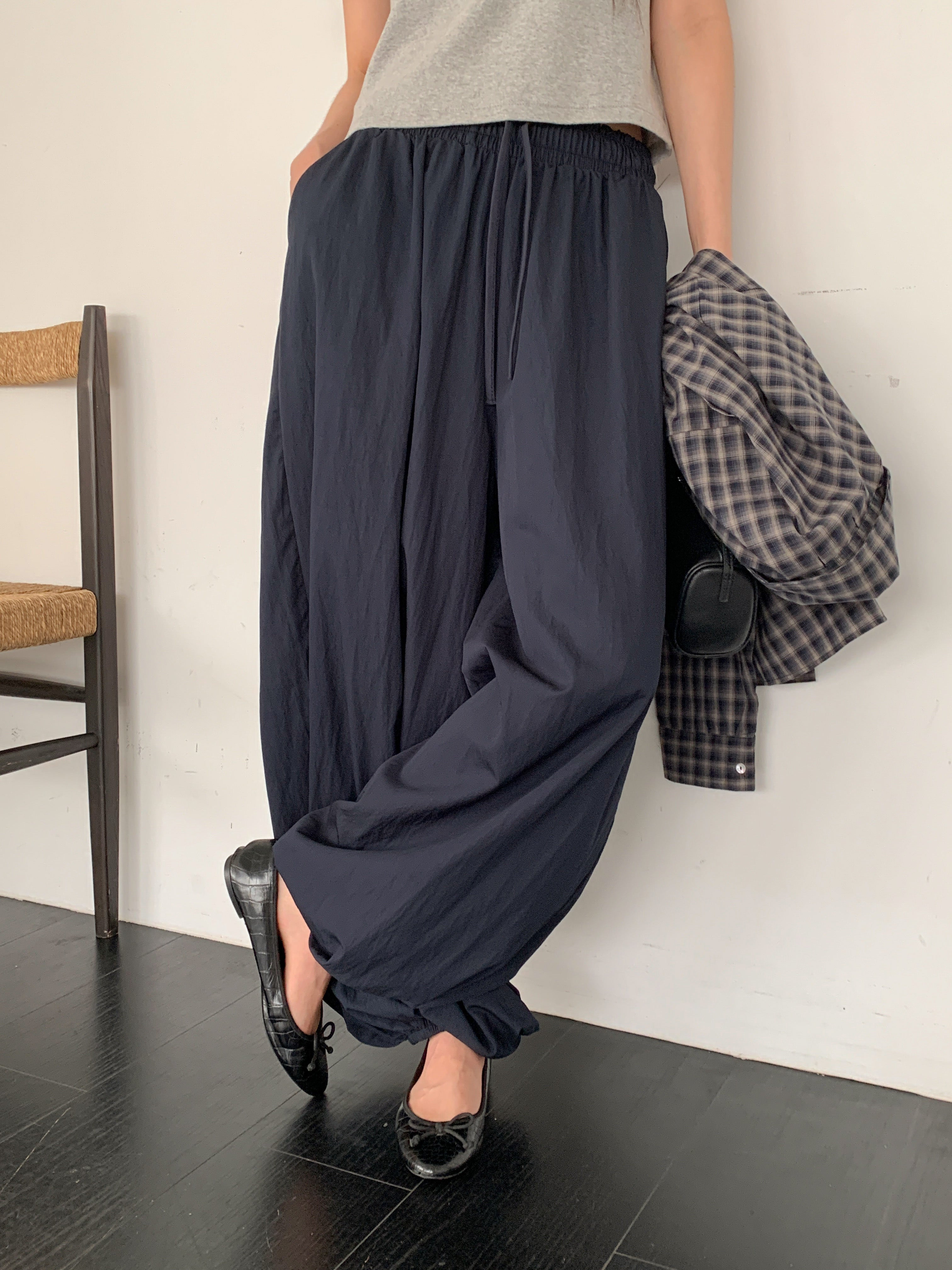 Merrymore drawstring elastic waist harem pants in Navy, styled on model front view close-up gathered ankle band hem detail with grey tank top