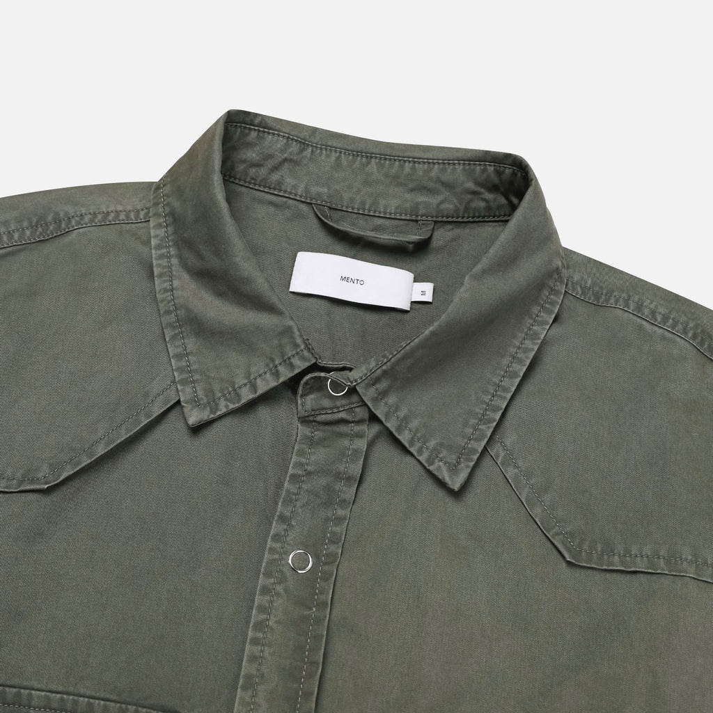 Pointed front yoke and collar detail on a khaki cotton western shirt