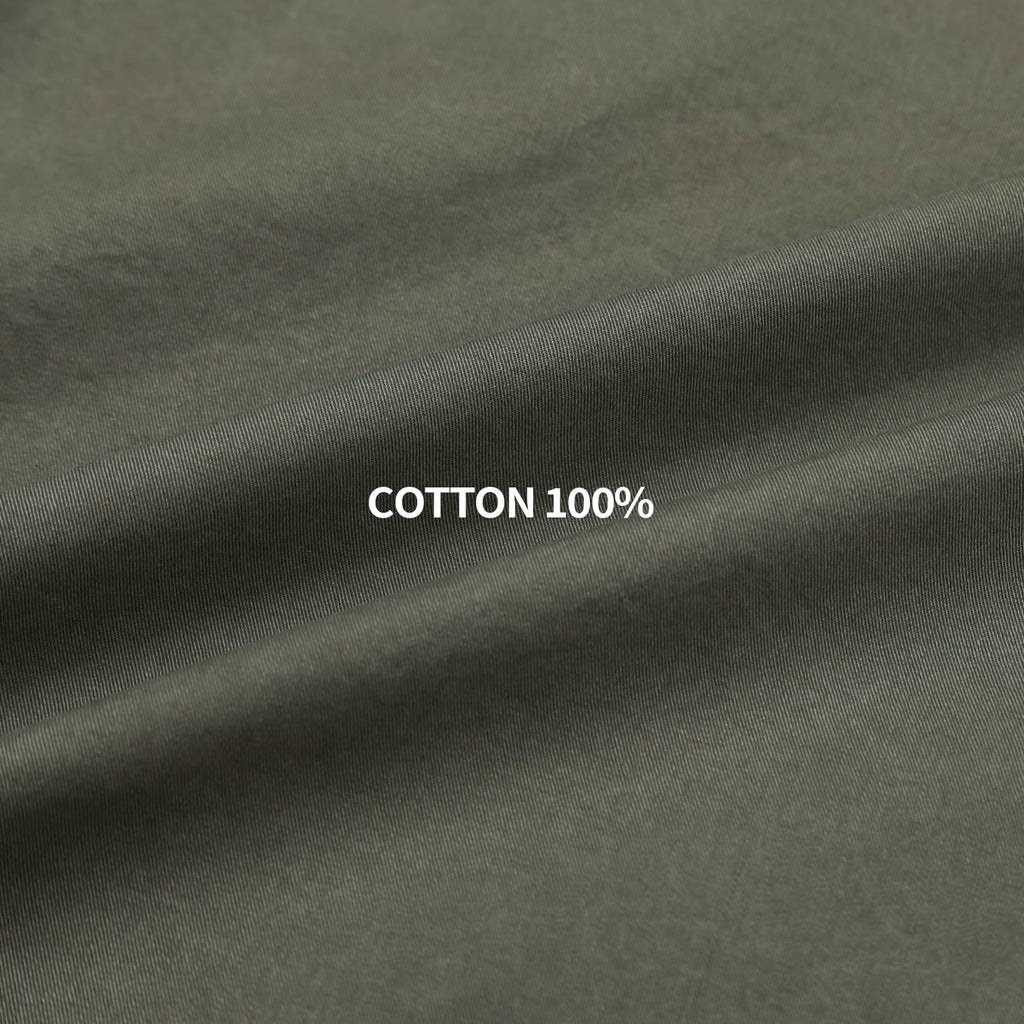 Pointed collar, front yoke and snap placket detail on a khaki western shirt