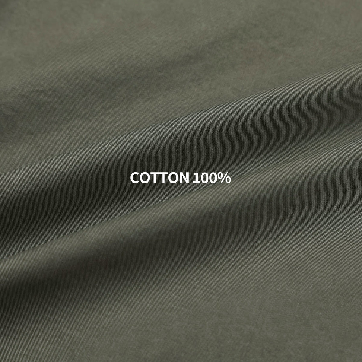 Pointed collar, front yoke and snap placket detail on a khaki western shirt