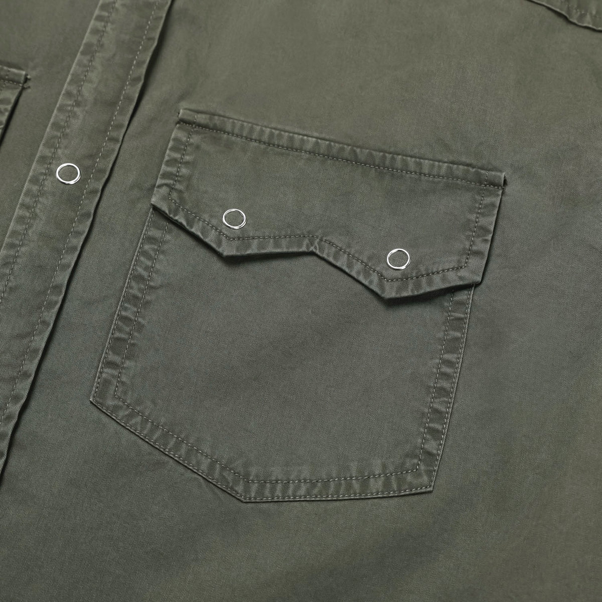 Flap chest pocket with snap buttons on a khaki cotton western shirt