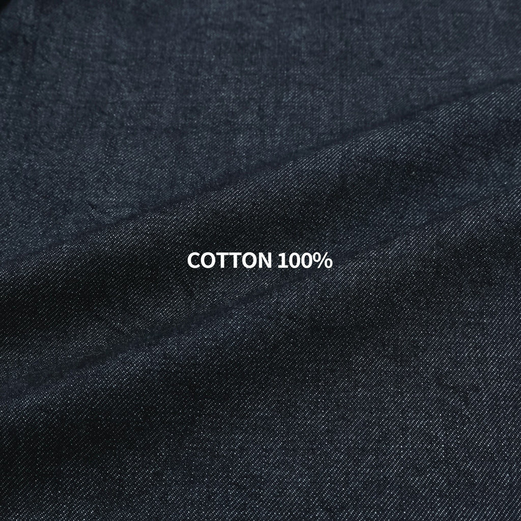 Close-up of dark indigo 100% cotton denim fabric