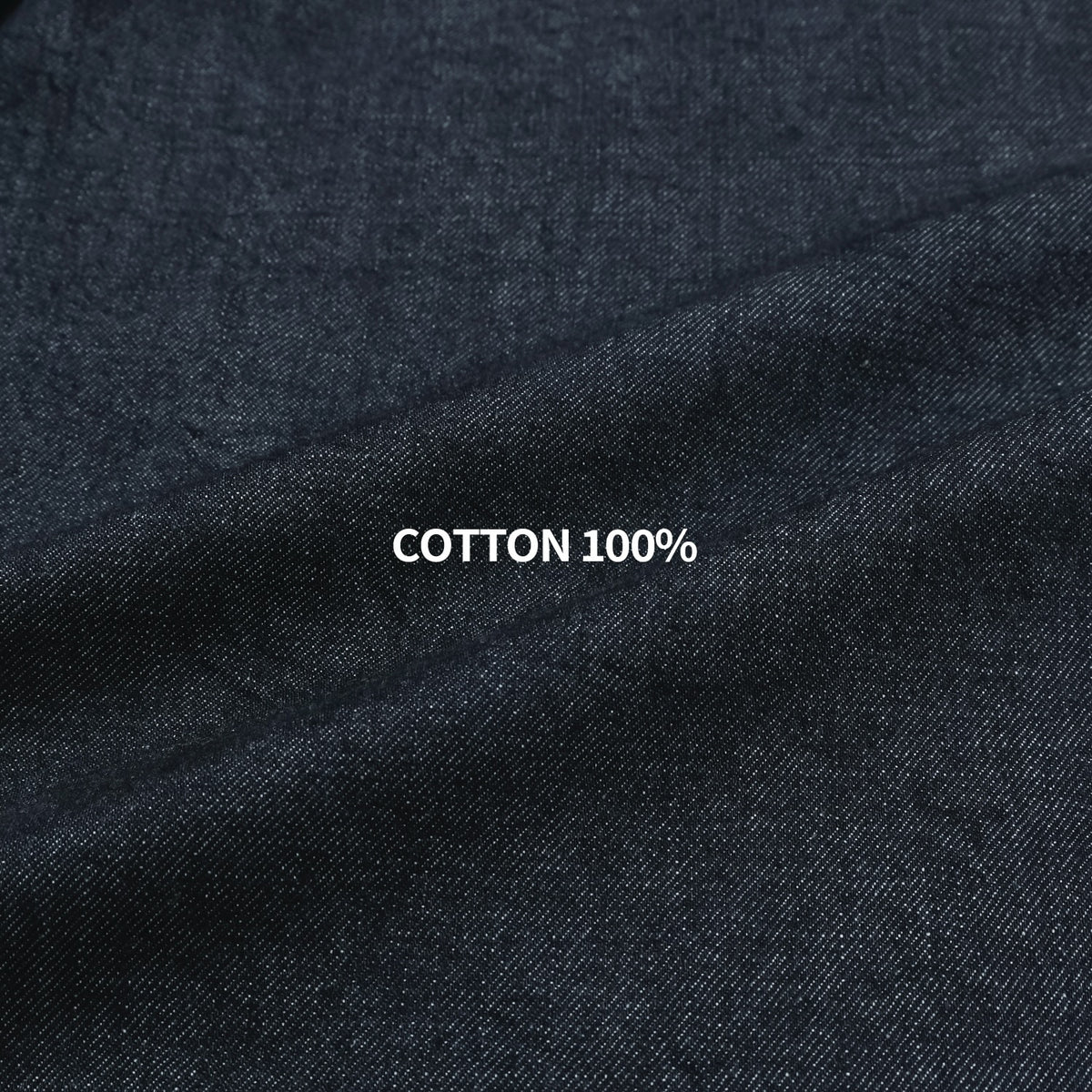 Close-up of dark indigo 100% cotton denim fabric