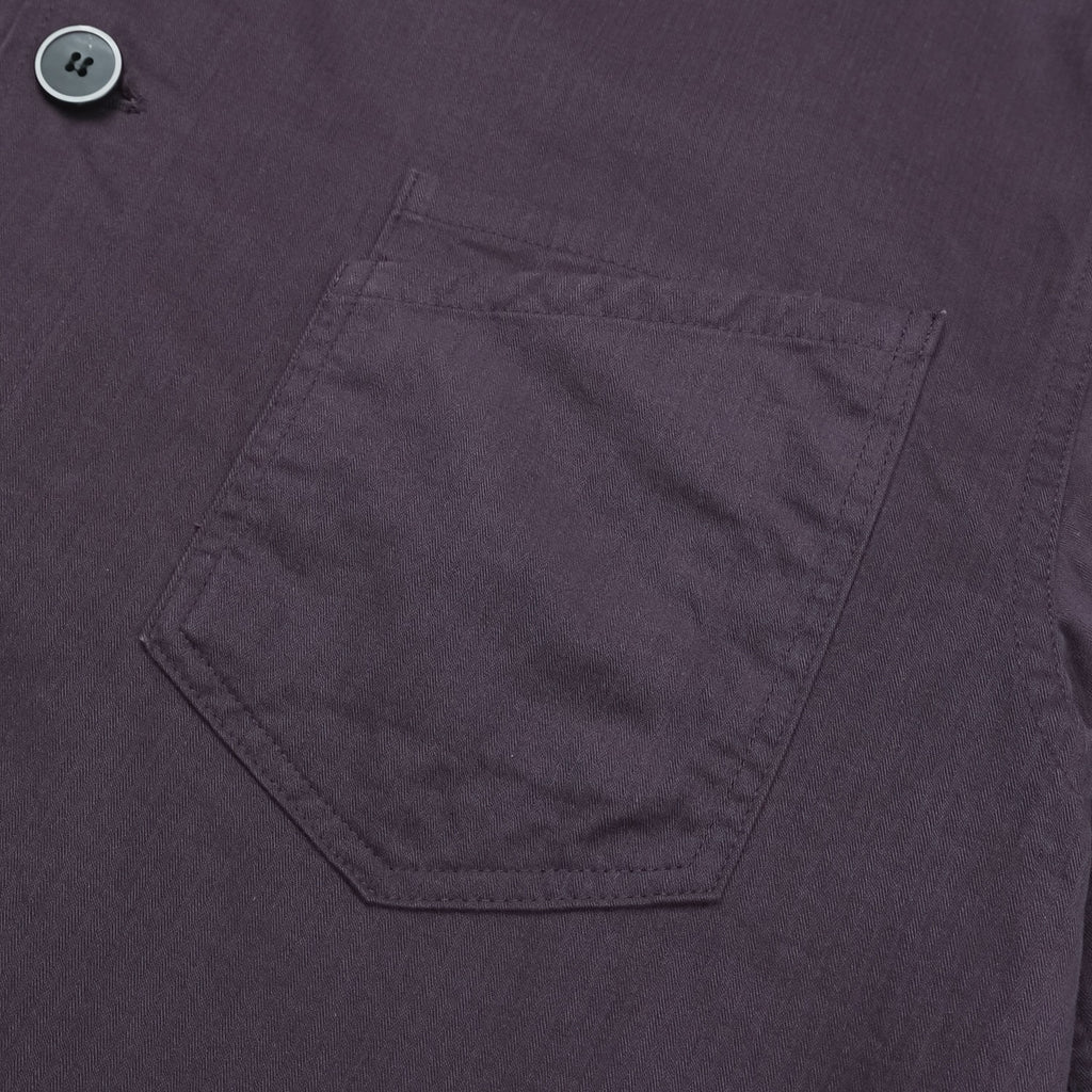 Straight hem and stitching detail on a purple cotton shirt jacket