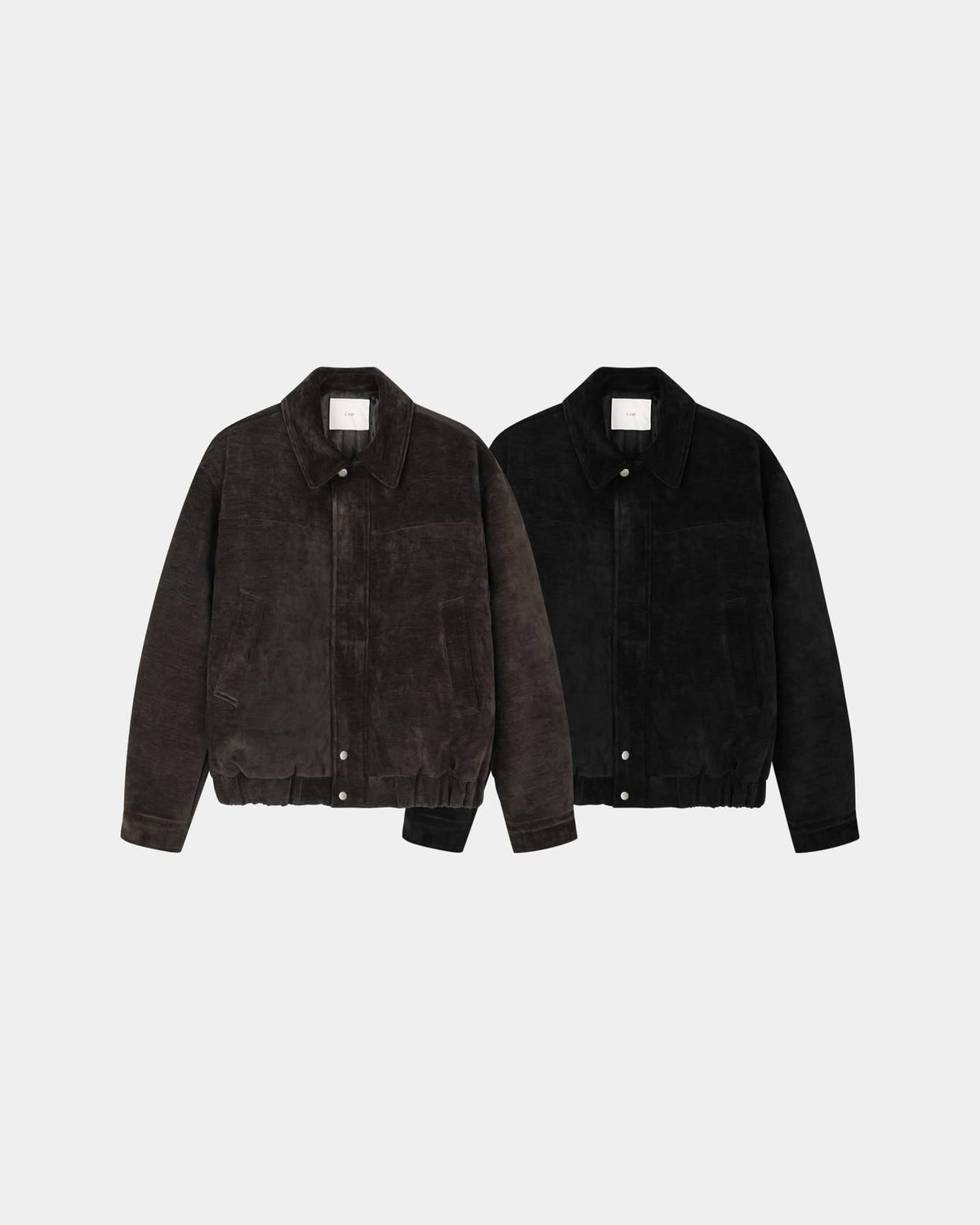 Close-up of the two-way metal zipper on a velvet blouson jacket