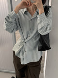 Rowsatnd striped long sleeve shirts in Ivory, Pastel Green and Sky Blue on hangers.