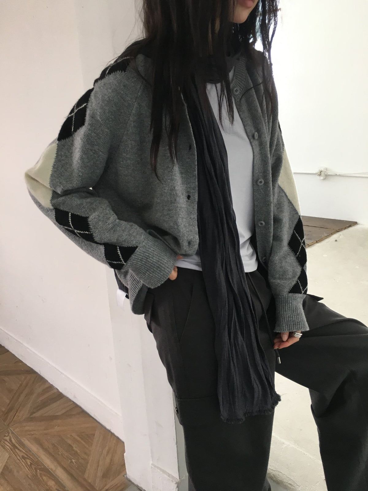 Charcoal argyle sleeve wool-blend cardigan styled with a long black skirt