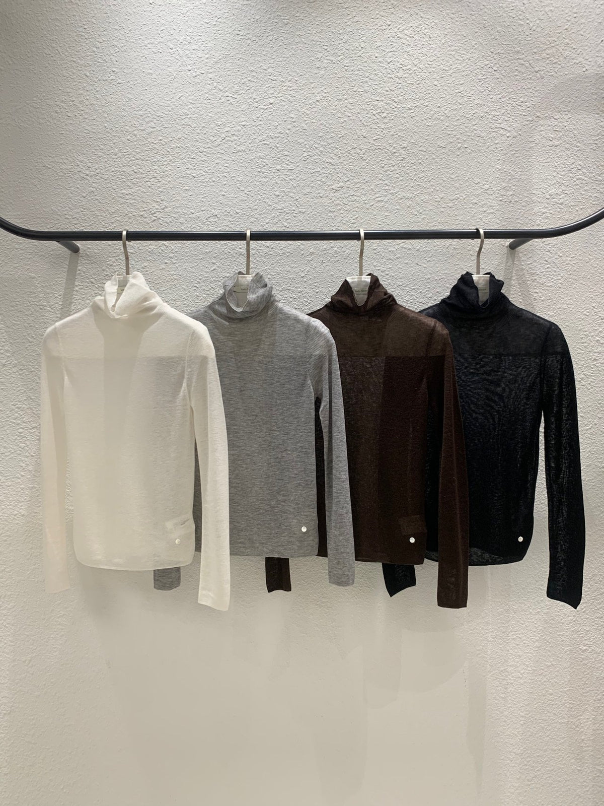 Ivory long-sleeve turtleneck sweater worn with blue jeans