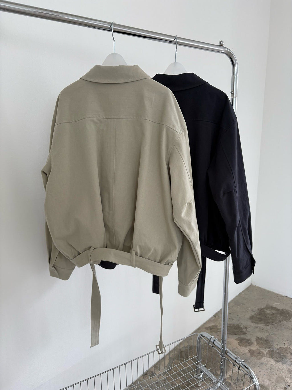 Side view of khaki beige cotton blouson jacket with gathered hem belt