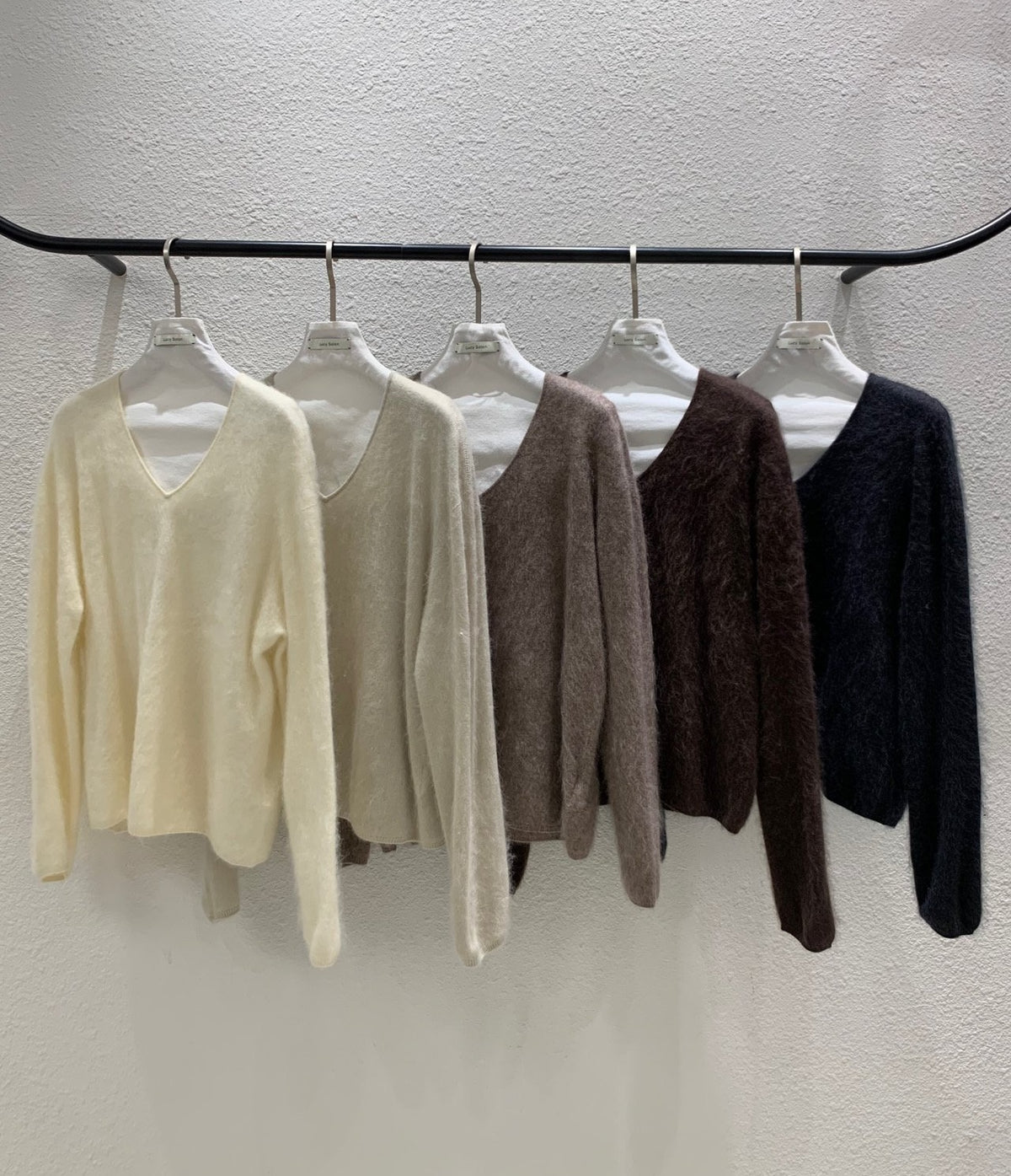 Close-up of ivory sweater ribbed hem and sleeve