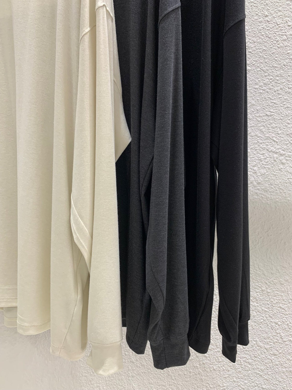 Black wrap top set styled under a jacket