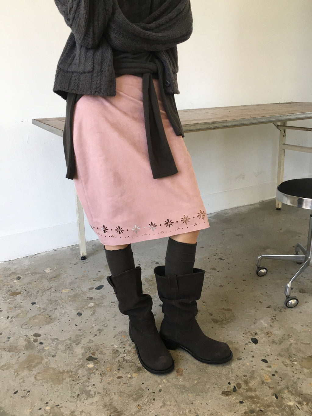 Charcoal suede midi skirt with floral cutout hem, back view