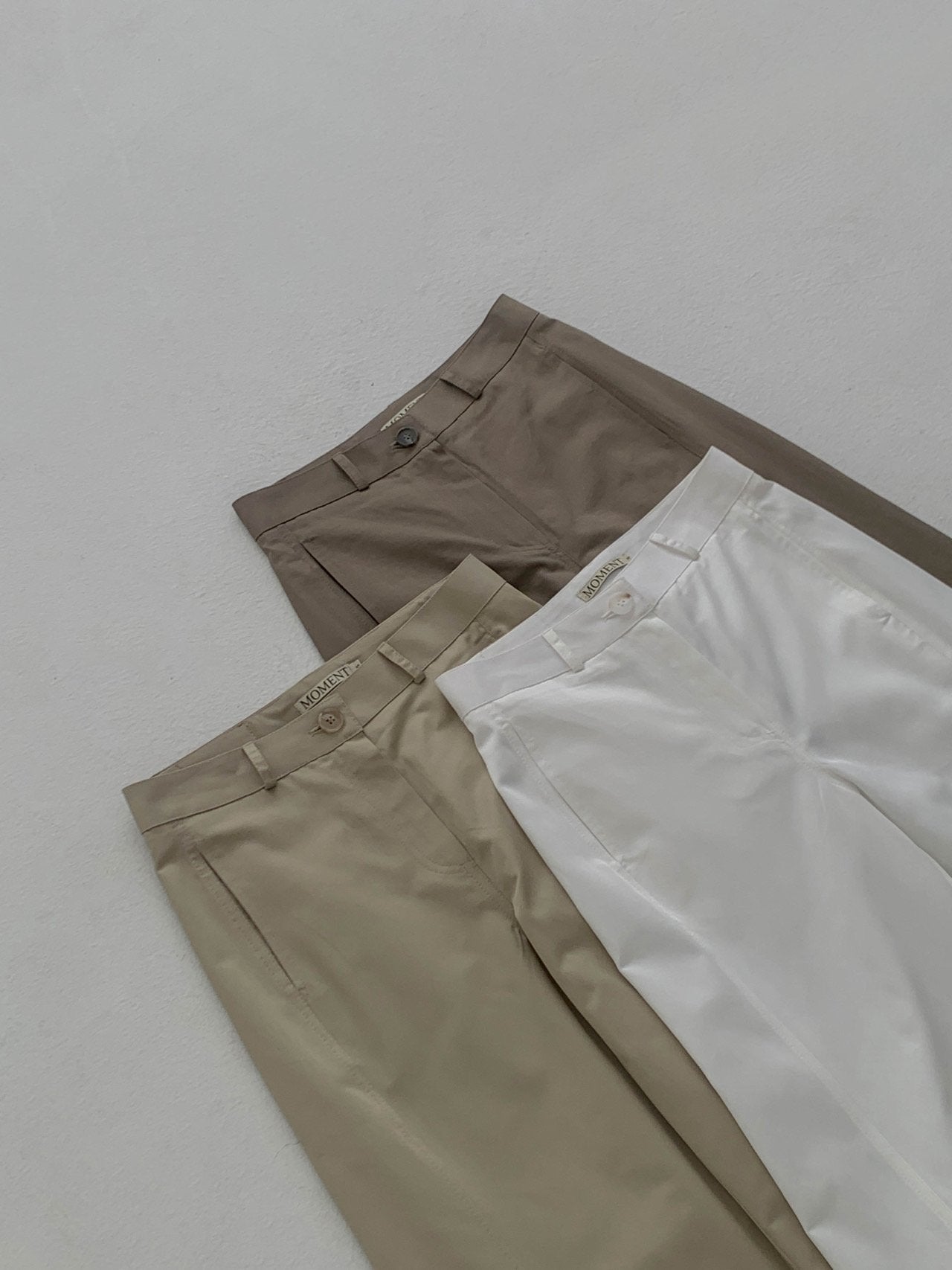 Moment curved seam wide leg pants in Light Khaki, back view close-up leather patch label